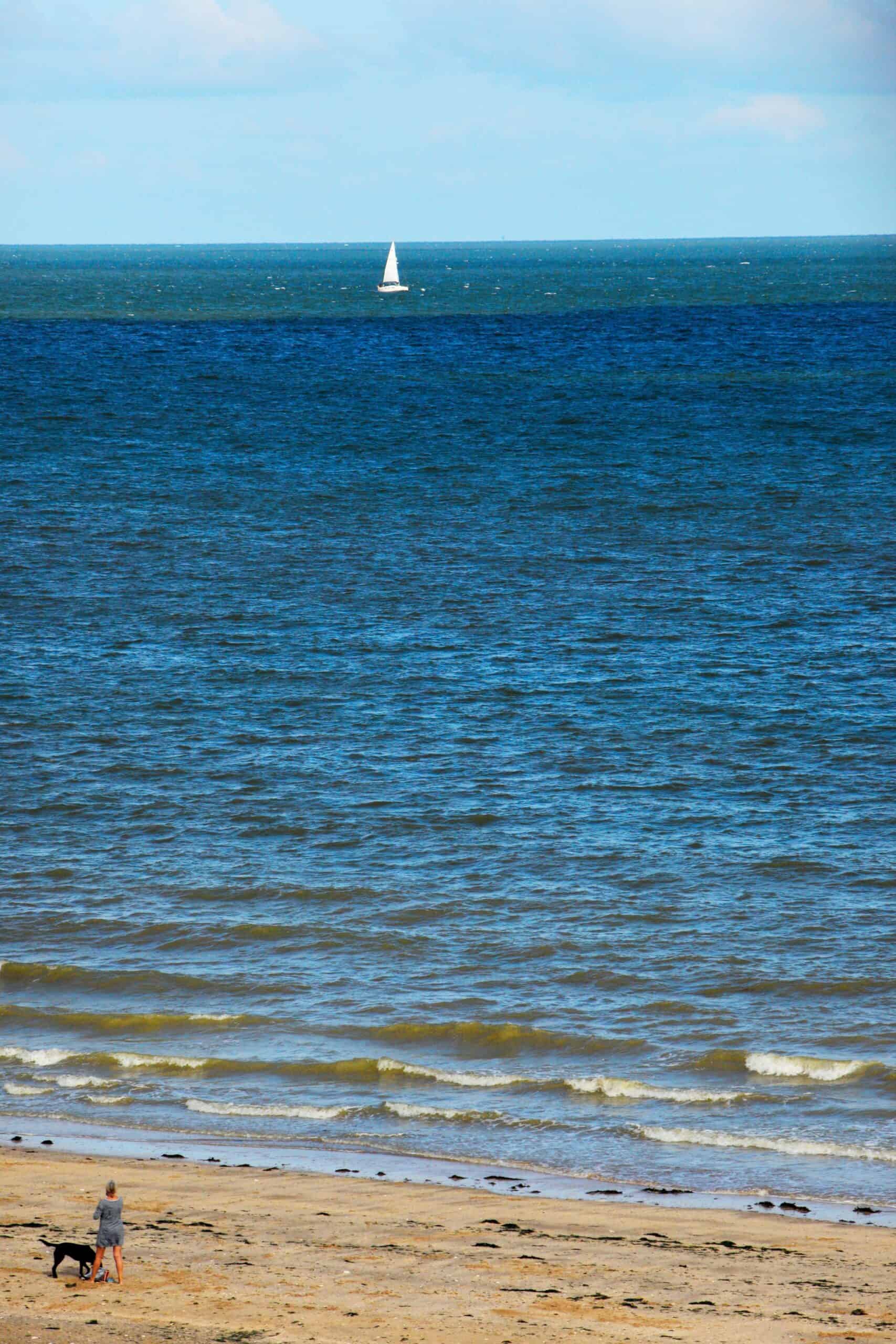 Beach ocean and sail boat