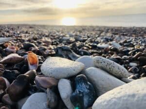 Pebble beach at sunrise in Goring. Hypnotherapy